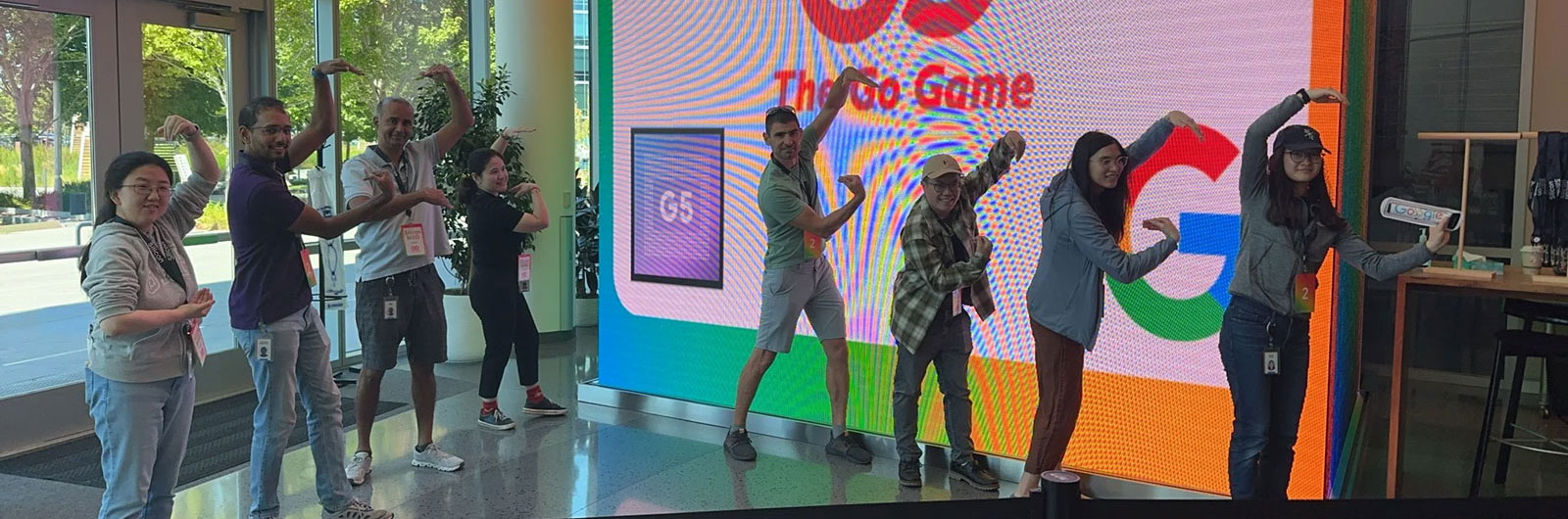 The Go Game host on stage with a cheering team
