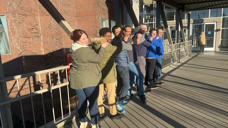 Participants pose together during the Clean Power Research Classic Adventure event in Bellevue.