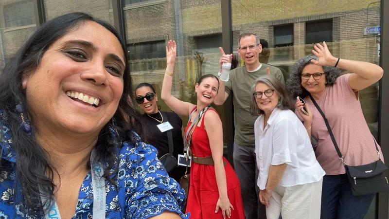 American Dental Education Association teammates take a playful outdoor selfie during their New Orleans Adventure.