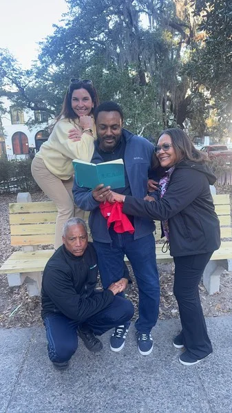 Participants pose together during the Merck Classic Adventure event in Savannah.